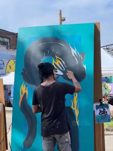 Focused artist brings a magnificent dragon to life!